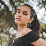 Woman in black off-shoulder top.